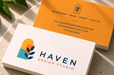 Stack of custom 12pt recycled uncoated business cards for Haven Design Studio with colorful arched botanical graphics