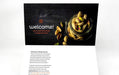 Custom 14pt uncoated matte postcards featuring a dark Naked Snacks welcome design with nuts and a white back side with text