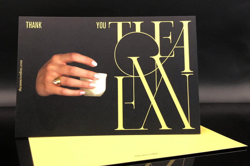 Custom 14pt uncoated matte postcards with black background, gold typography, and photo print design
