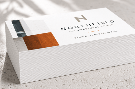 Stack of custom printed 24pt recycled uncoated business cards for Northfield Architectural Studio showing extra thick paper edge quality
