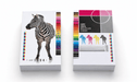 Stacks of custom-printed 100% recycled 12pt uncoated postcards for Clubcard Printing displaying a photorealistic zebra, four colorful zebra icons, and print calibration bars against a clean white background.