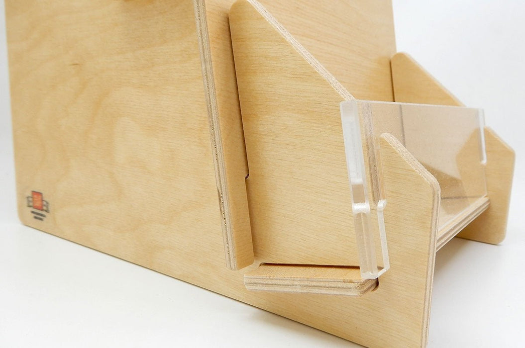close-up view of the clear acrylic front panel and wood shelf detail of a 3-tier birch wood slim card display rack made in the USA. Clubcard Printing in Palm Springs
