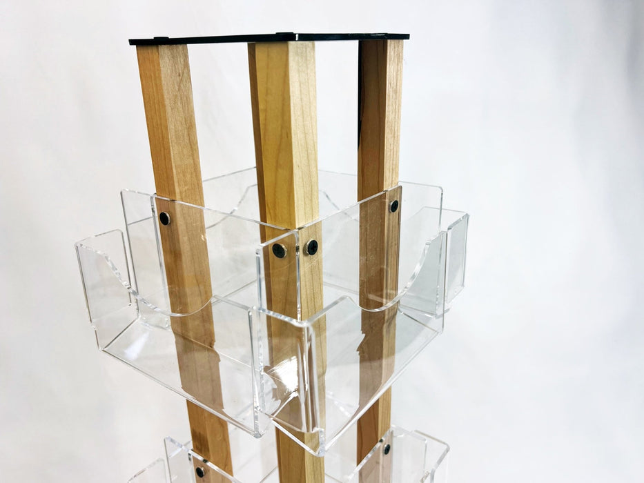 Detail view of the inner wooden support structure and clear acrylic pocket brackets on a countertop card spinner by Clubcard Palm Springs