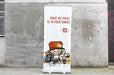 Clubcard Printing 33 wide by 80 tall retractable banner stand displayed against a concrete wall