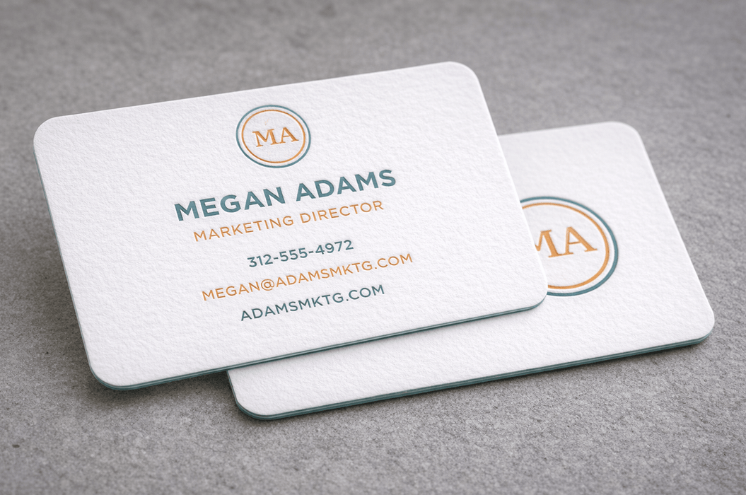 Two 20pt white cotton letterpress business cards with rounded corners
