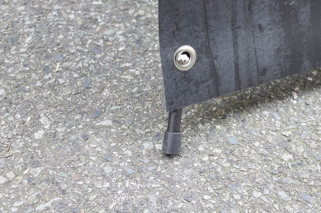 Close-up view of bottom corner grommet secured to the lower support leg of a 24x60 outdoor X banner stand. Clubcard Printing USA