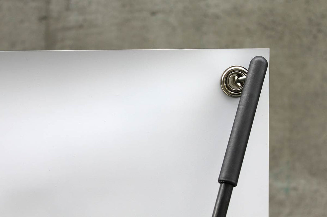 Close-up shot of top corner grommet attached to the upper hook of a 24x60 outdoor X banner stand