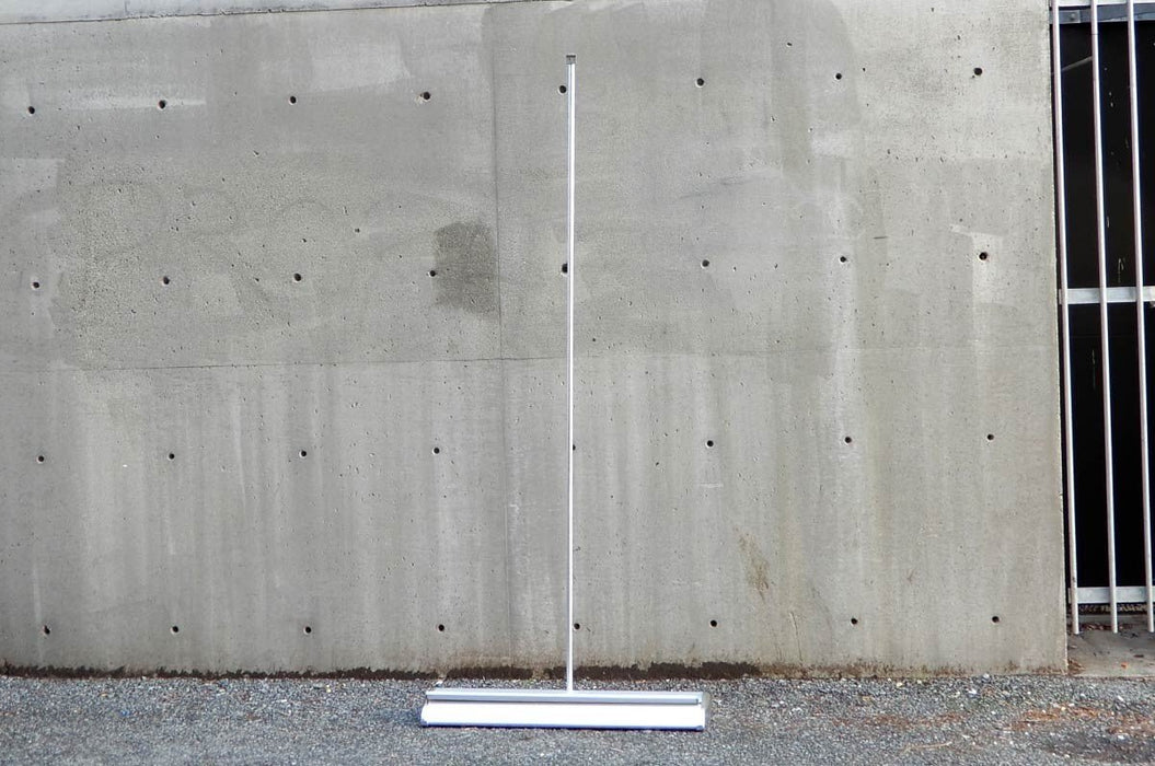 view of a premium wide-base retractable banner stand showing vertical support pole assembly. Clubcard Printing USA