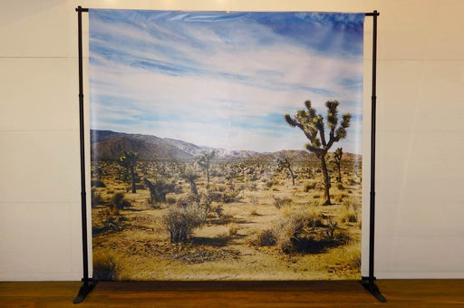 Adjustable telescopic frame backdrop banner stand set up for photo ops and event trade show displays. Clubcard Palm Springs