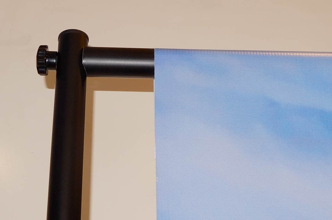 Close-up view of top corner connector clamp and horizontal crossbar attachment on a telescopic backdrop banner stand