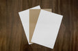 Coated and uncoated white with desert storm uncoated blank card stocks.